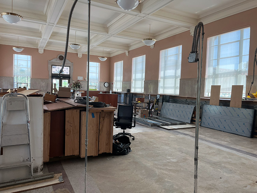 Reading room with exposed floor and construction material