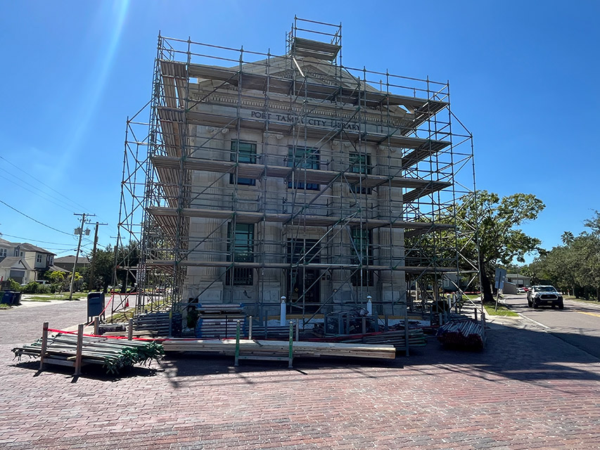 Front of building surrounded by scaffolding