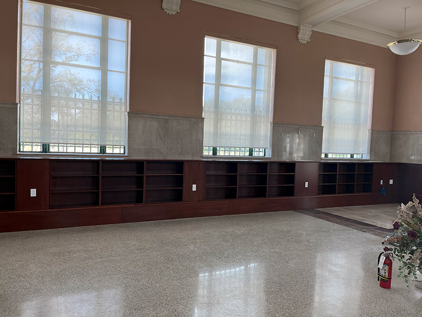 Empty refinished room with three shaded windows