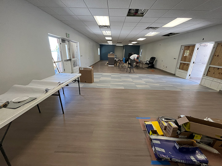 Narrow lobby area with construction materials
