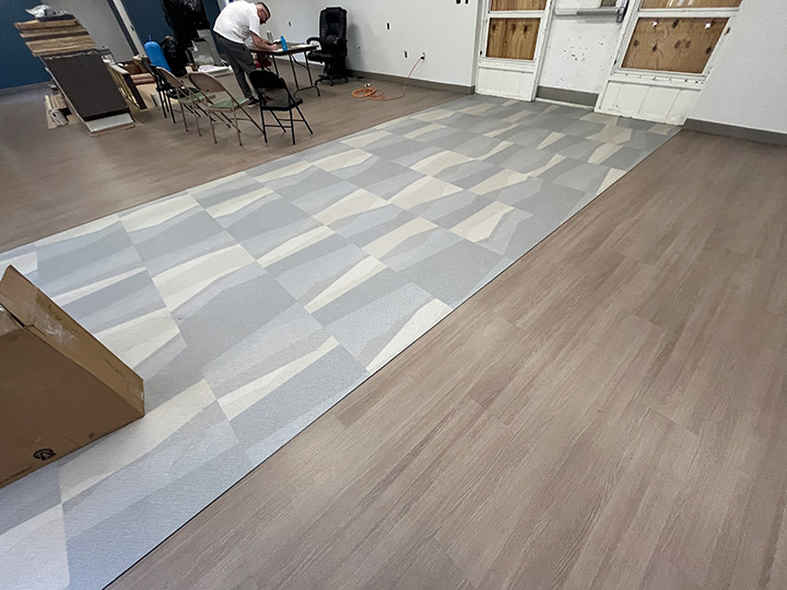 Path of grey tiles from entrance in lobby area